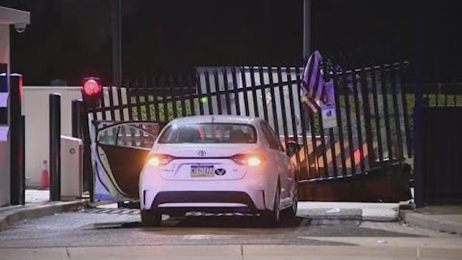 A man in a white sedan crashed into one of the vehicle entrances at the FBI's Pittsburgh office before jumping out of the car, throwing an American flag onto the damaged gate and fleeing on foot.
