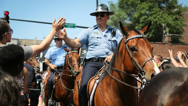A Chicago police officer on horseback participates in a parade in 2012. The U.S. Immigration and Customs Department ran a local commercial during a Monday night NFL broadcast designed to recruit Chicago officers to the agency.