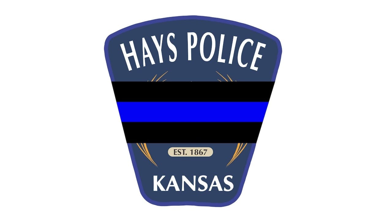 When a Hays police officer was arriving at the scene of a domestic violence call, a suspect opened fire, and the officer was fatally struck.