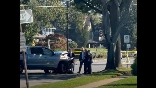 A Nassau police motorcycle officer was rushed to the hospital in serious condition after crashing into a pickup truck as part of a funeral procession for a relative of another officer in Lindenhurst.