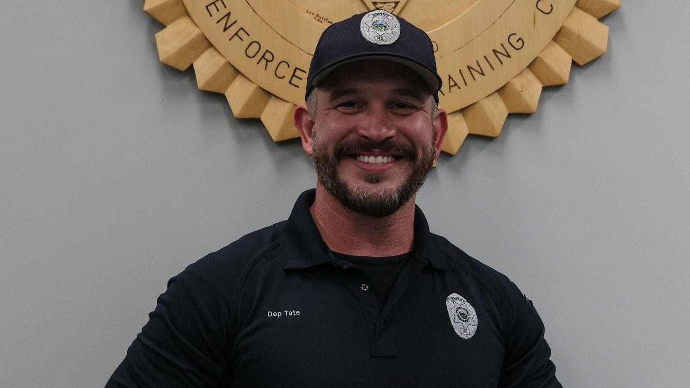 Sedgwick County, KS, Sheriff's Deputy Garry Tate was working an off-duty security job Saturday at Wichita's Blocktoberfest when he was prompted by his boss to take the stage as a last-minute contestant in a Dad Bod contest.