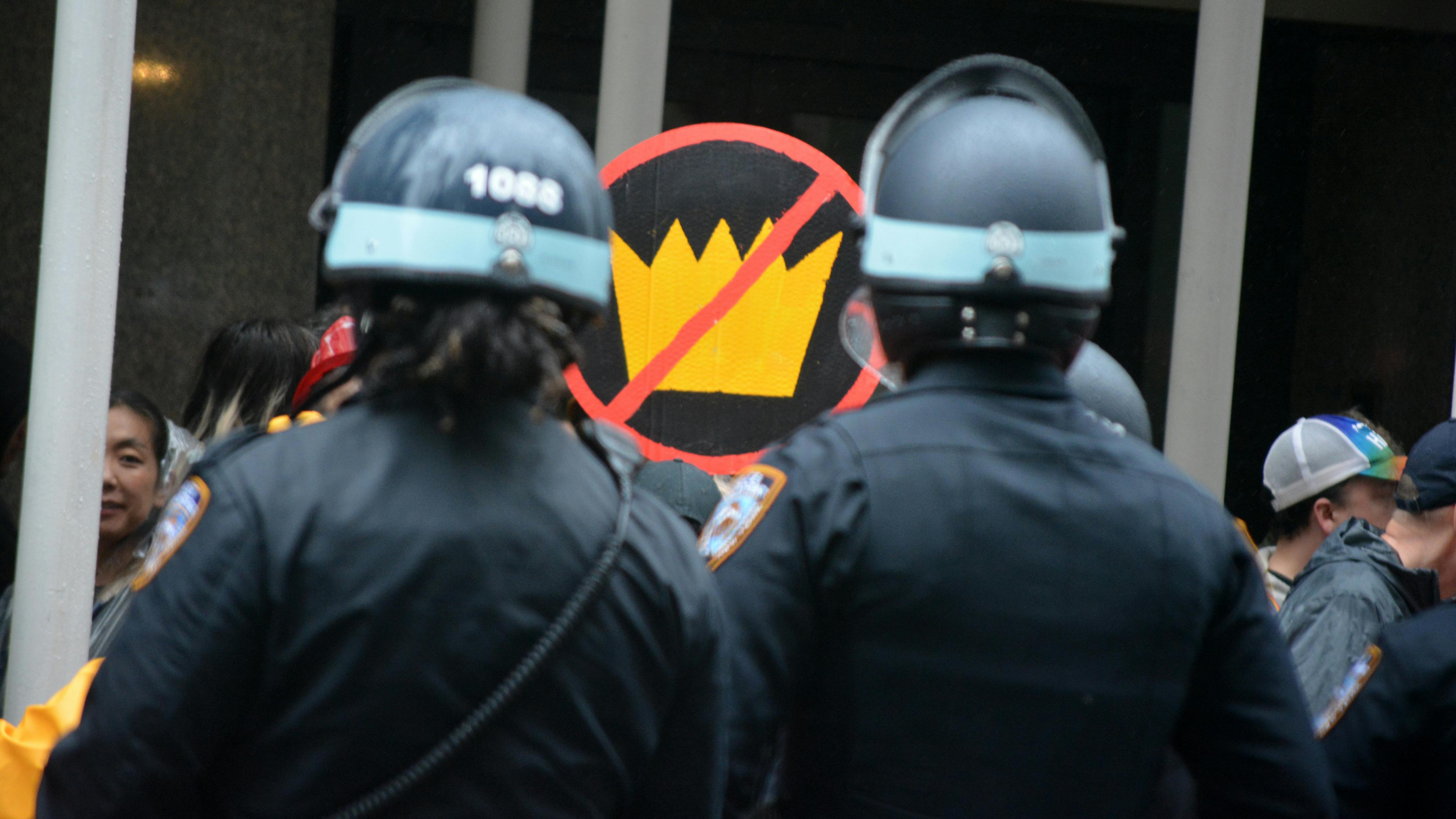 NYPD officers look on during a 'No Kings' protest march in New York City on June 14.