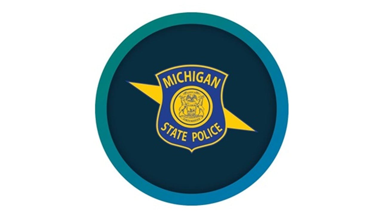 A Michigan State Police trooper was investigating a single-vehicle crash when a Jeep Cherokee struck the back of the trooper's patrol vehicle.