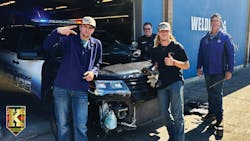 Kelso, WA, High School senior Hunter Evans (left), senior Tim Fowler and instructor Steve Mahitka work on a decommissioned police vehicle. Kelso, WA, High School senior Hunter Evans (left), senior Tim Fowler and instructor Steve Mahitka work on a decommissioned police vehicle.