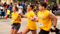 Racers participate in the 25th Baltimore Running Festival on Saturday. A Baltimore police officer suffered a mild skull fracture when he was dragged roughly 20 feet by a driver. Racers participate in the 25th Baltimore Running Festival on Saturday. A Baltimore police officer suffered a mild skull fracture when he was dragged roughly 20 feet by a driver.