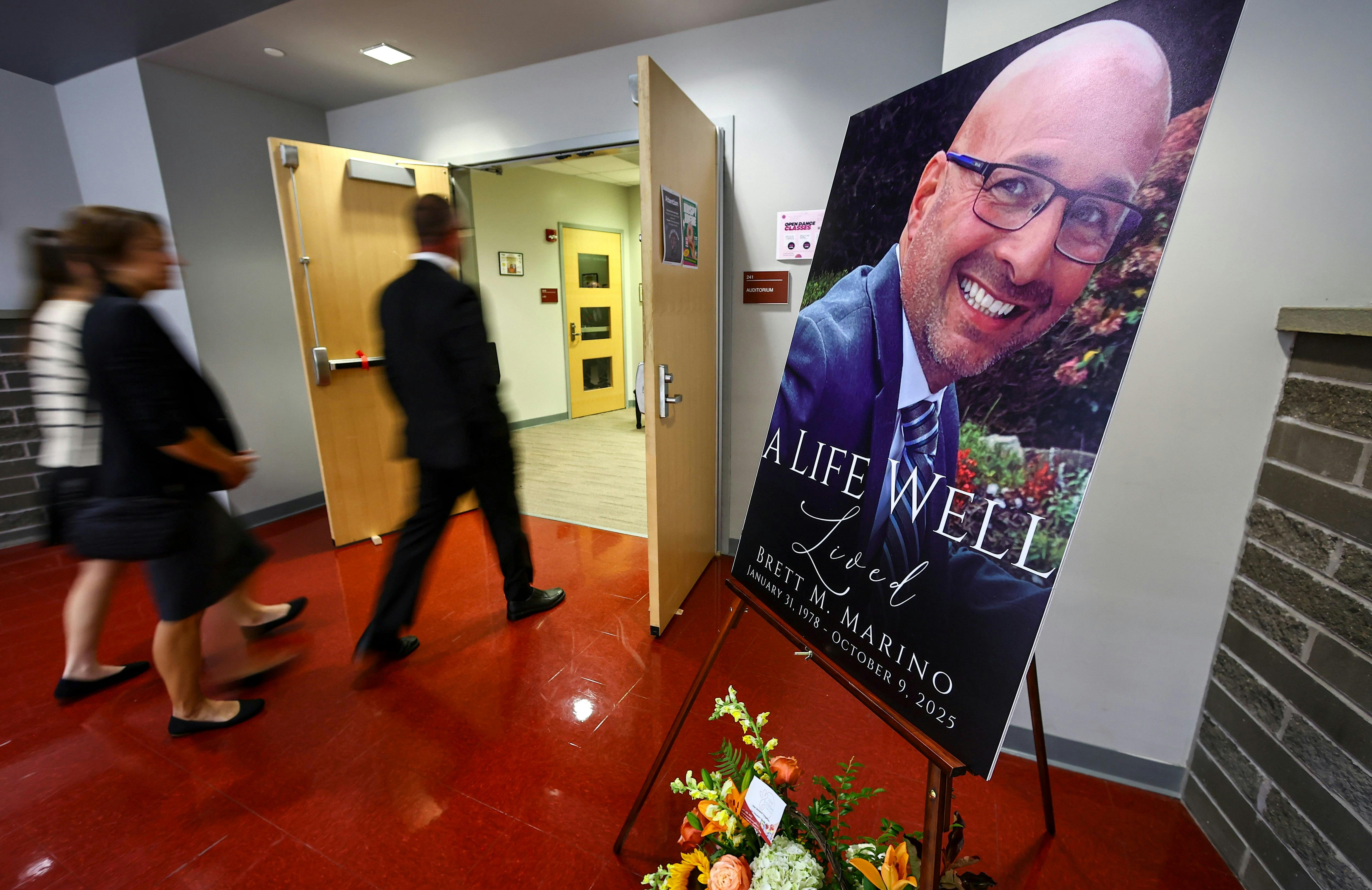Family, friends and members of the community gather at Phillipsburg, NJ, High School's auditorium Saturday for a memorial service in honor of Officer Brett Marino.