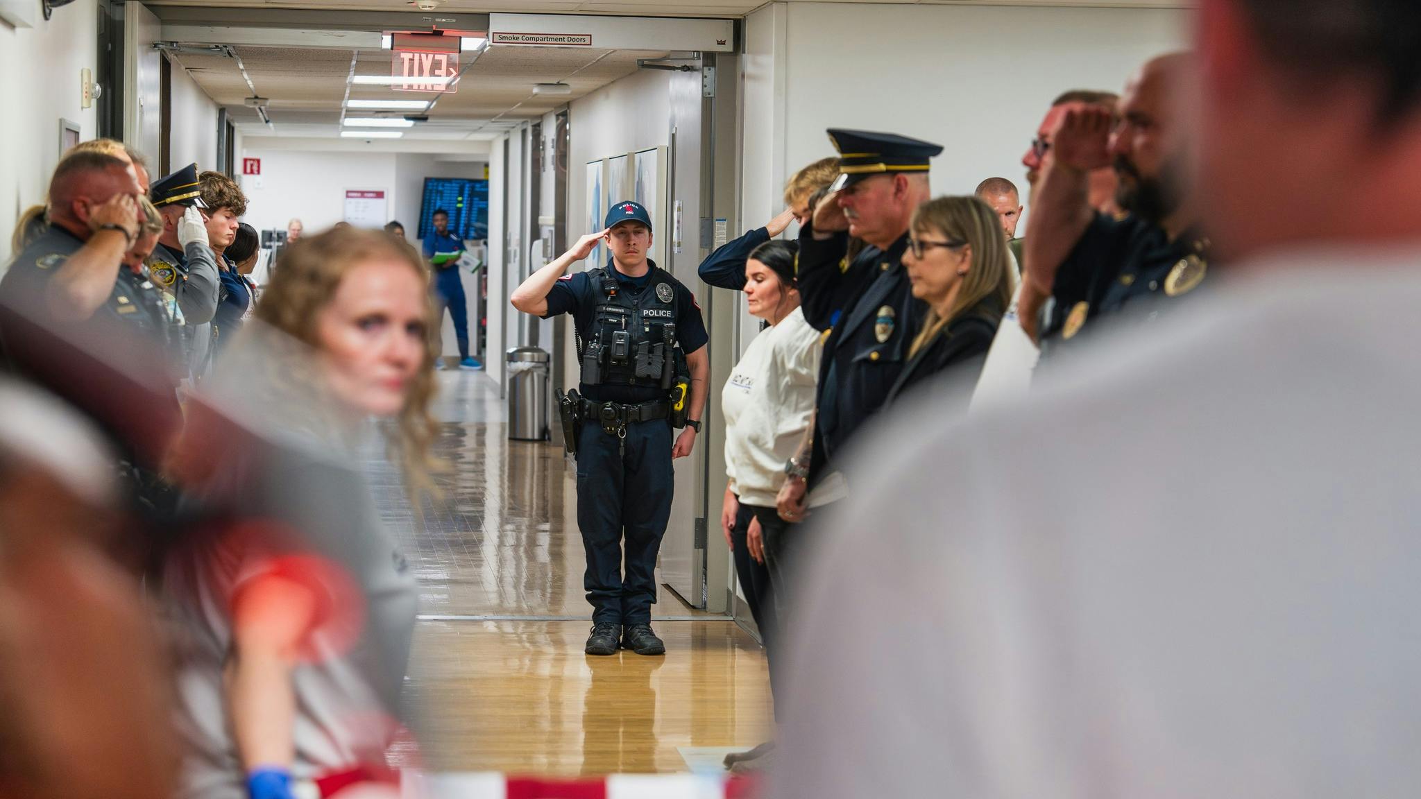 Law enforcement officers salute as an honor walk is performed for El Reno, OK, Police Sgt. Thomas Duran, who died from injuries he suffered in an Oct. 17 hit-and run crash while he was helping a pedestrian.