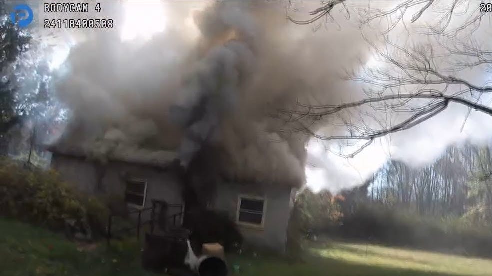 'It was just adrenaline, and that the only thing I wanted to do was to get her out of that house alive,' said St. Charles Police Officer Ryan Hull about rescuing a bedridden woman from a home nearly engulfed in flames.