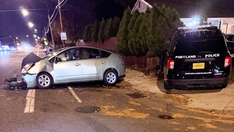 Two Portland, OR, police officers were injured Sunday when a motorist accused of driving under the influence allegedly crashed nearly head-on into a Portland police SUV.
