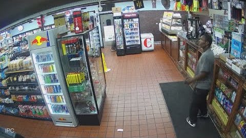 An armed suspect, who had earlier tried to carjack a vehicle, is accused of barricading himself inside a gas station and aiming a gun at a woman before a senior New Orleans police officer shot him in the shoulder.