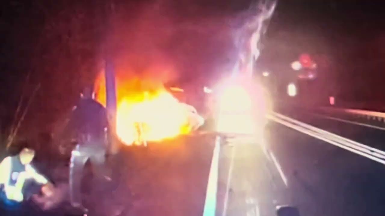 As a smoke poured from a crashed car in Franklin, two South Brunswick used a breaching tool to shatter a window and rescue an unresponsive driver before the car burst into flames.