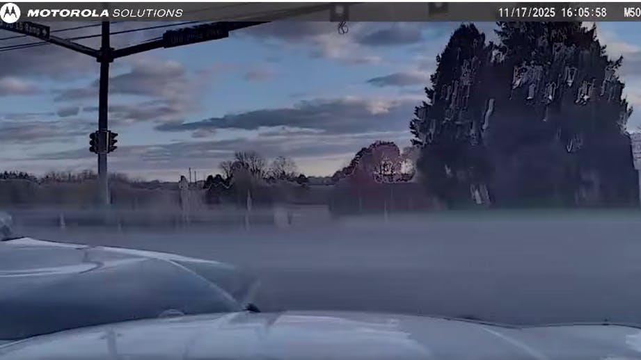 A driver who was allegedly cleaning his glasses ran a red light and collided with an East Lampeter Township, PA, police cruiser Monday, injuring an officer and passenger inside the unit.