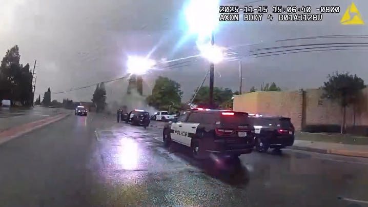 Overhead power lines spark and flash as Fountain Valley police officers approached an alleged impaired driver who crashed into an electrical pole Sunday.