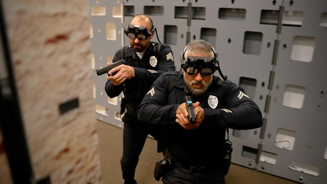 Officers are seen using the fats AR - Augmented Reality Weapons Training system.