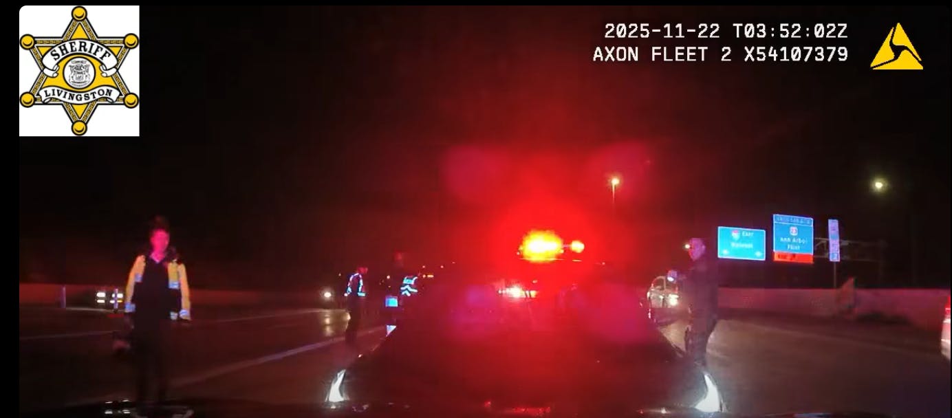 A driver stopped along the interstate in Brighton, MI, on Friday refused to get out of his vehicle before accelerating and pushing a Livingston County sheriff's deputy's parked cruiser into an adjacent lane of traffic.