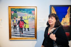 Shannon Cockett is seen with her painting 'Crossing to School.' Shannon Cockett is seen with her painting 'Crossing to School.'