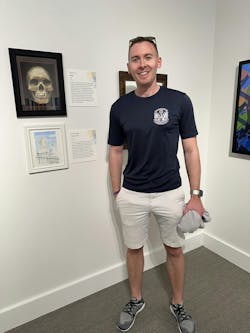 Winston Pingeon is seen with his painting 'Peace Circle.' Winston Pingeon is seen with his painting 'Peace Circle.'