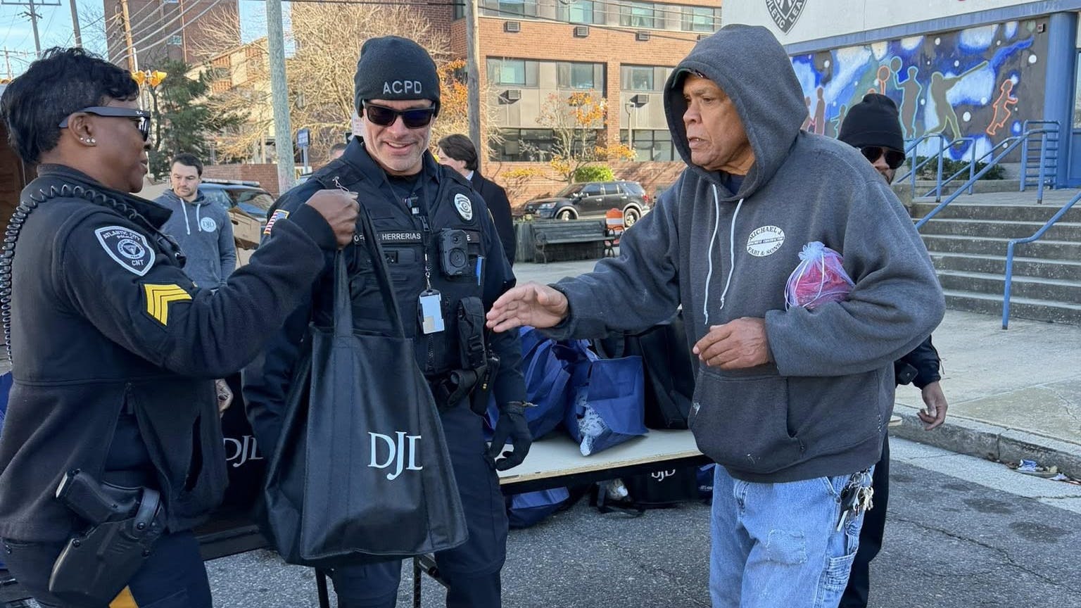 Atlantic City, NJ, police officers distributed 250 turkeys to families in need Monday as part of the department's annual Thanksgiving Turkey Giveaway at the Atlantic City Police Athletic League building.
