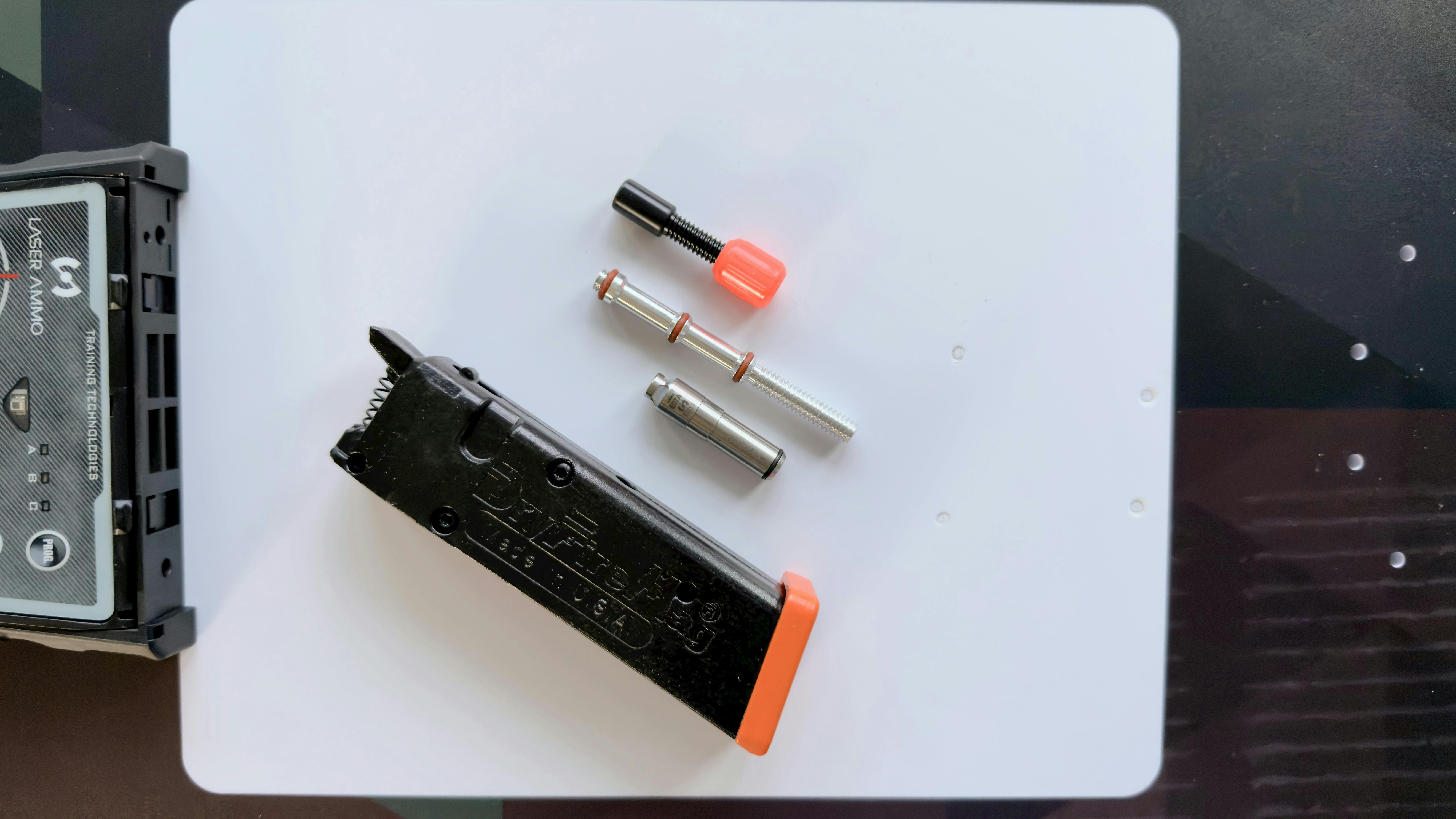 At the heart of the system is the SureStrikeMAG. It includes the Laser Ammo SureStrike laser cartridge and Smart DryFireMag. The DryFireMag allows laser training without resetting the trigger. When Lindsey used it, he found that the trigger felt exactly like his stock Glock trigger, except it did not require racking the slide for reset.