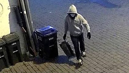 Security camera footage of a suspect accused of setting pipe bombs Jan. 5, 2021, outside Democratic and GOP headquarters in Washington, D.C.