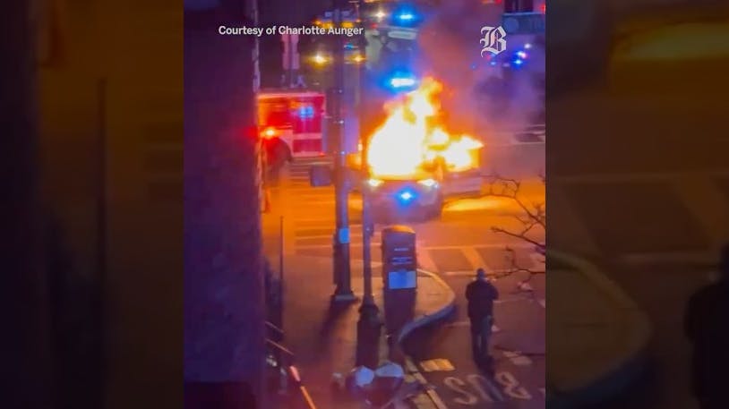A Boston police cruiser is set on fire during a 100-person street takeover in October.