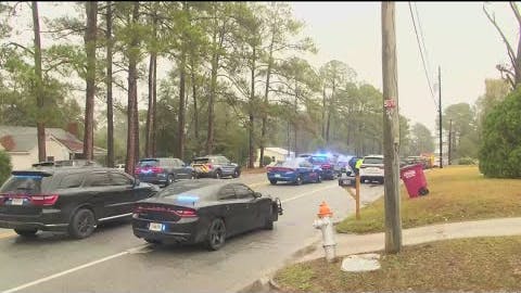 Two Tifton, GA, police officers were shot and wounded Friday while trying to serve a search warrant.