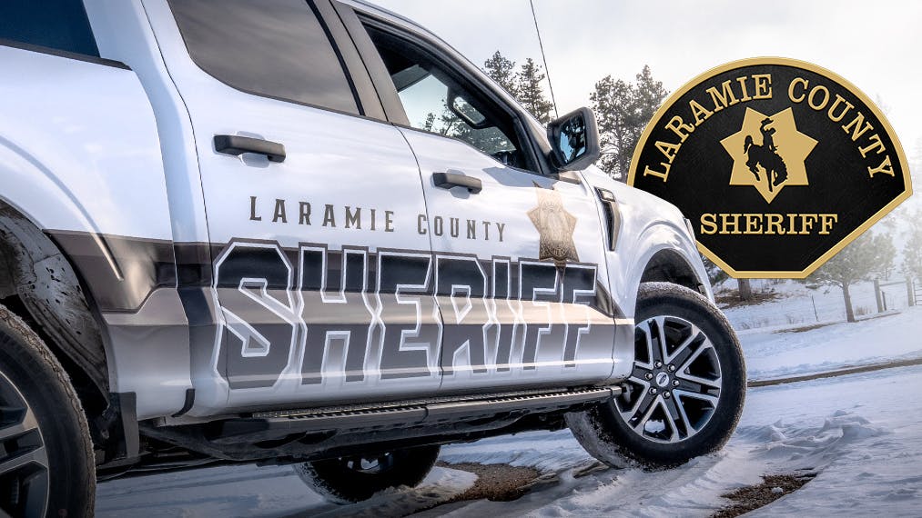 A Laramie County, WY, sheriff's deputy's cruiser was damaged when an overloaded semi rolled onto the vehicle.
