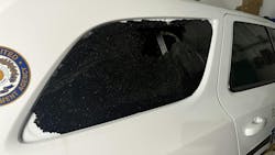 A Paducah, KY, police cruiser's shattered window from a suspect's gunfire. A Paducah, KY, police cruiser's shattered window from a suspect's gunfire.