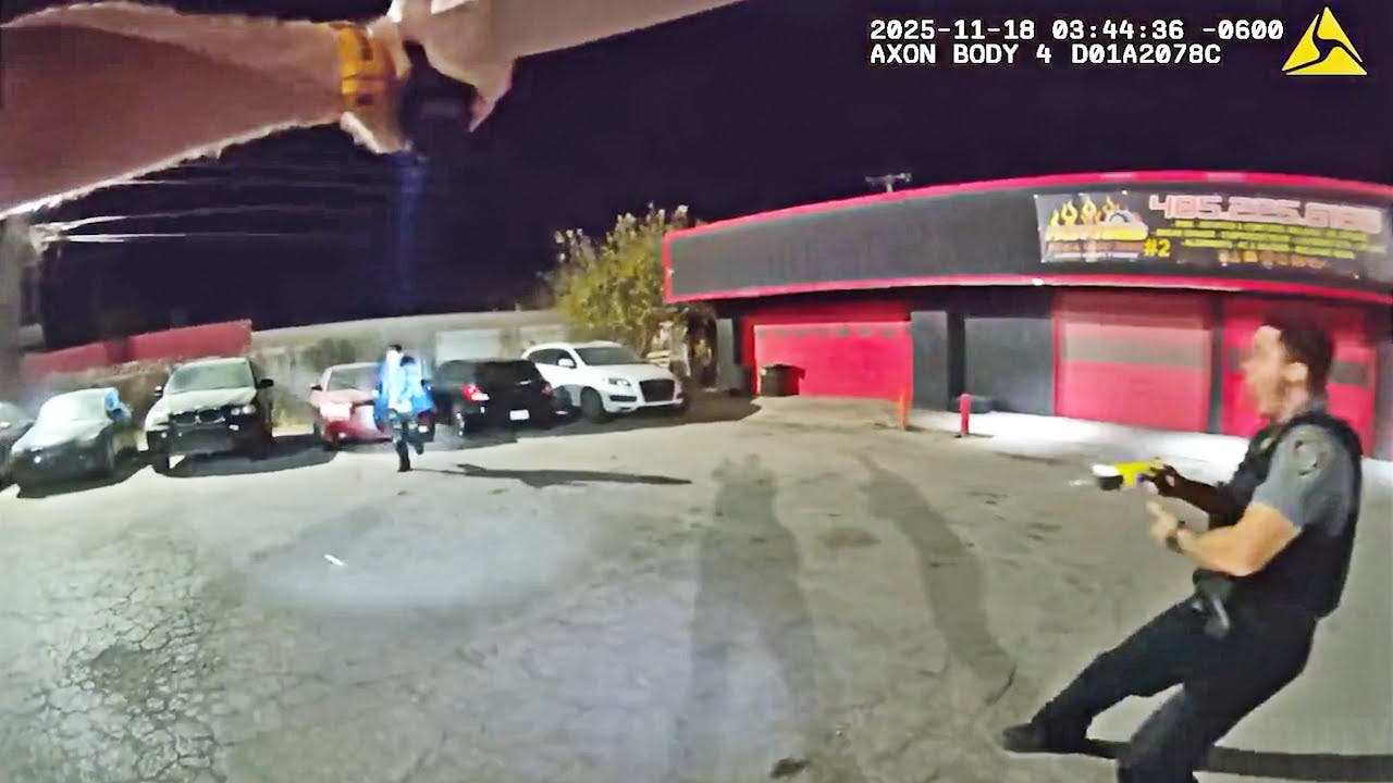 A suspect armed with a machete charges at Oklahoma City, OK, police officers.