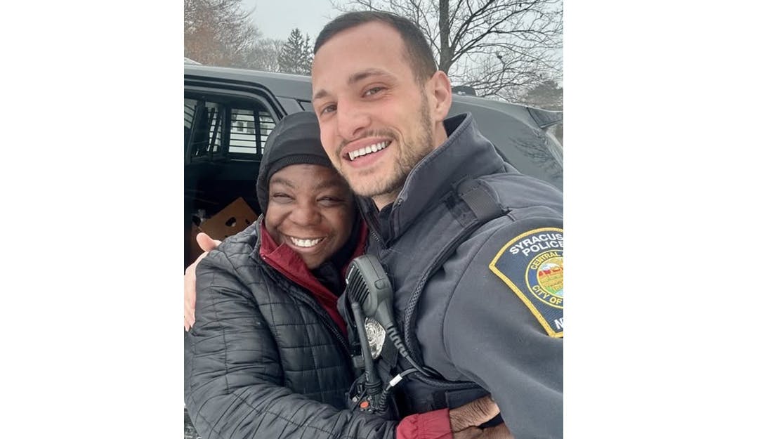 Syracuse, NY, Police Officer James Pastorello and Rhea Holmes.
