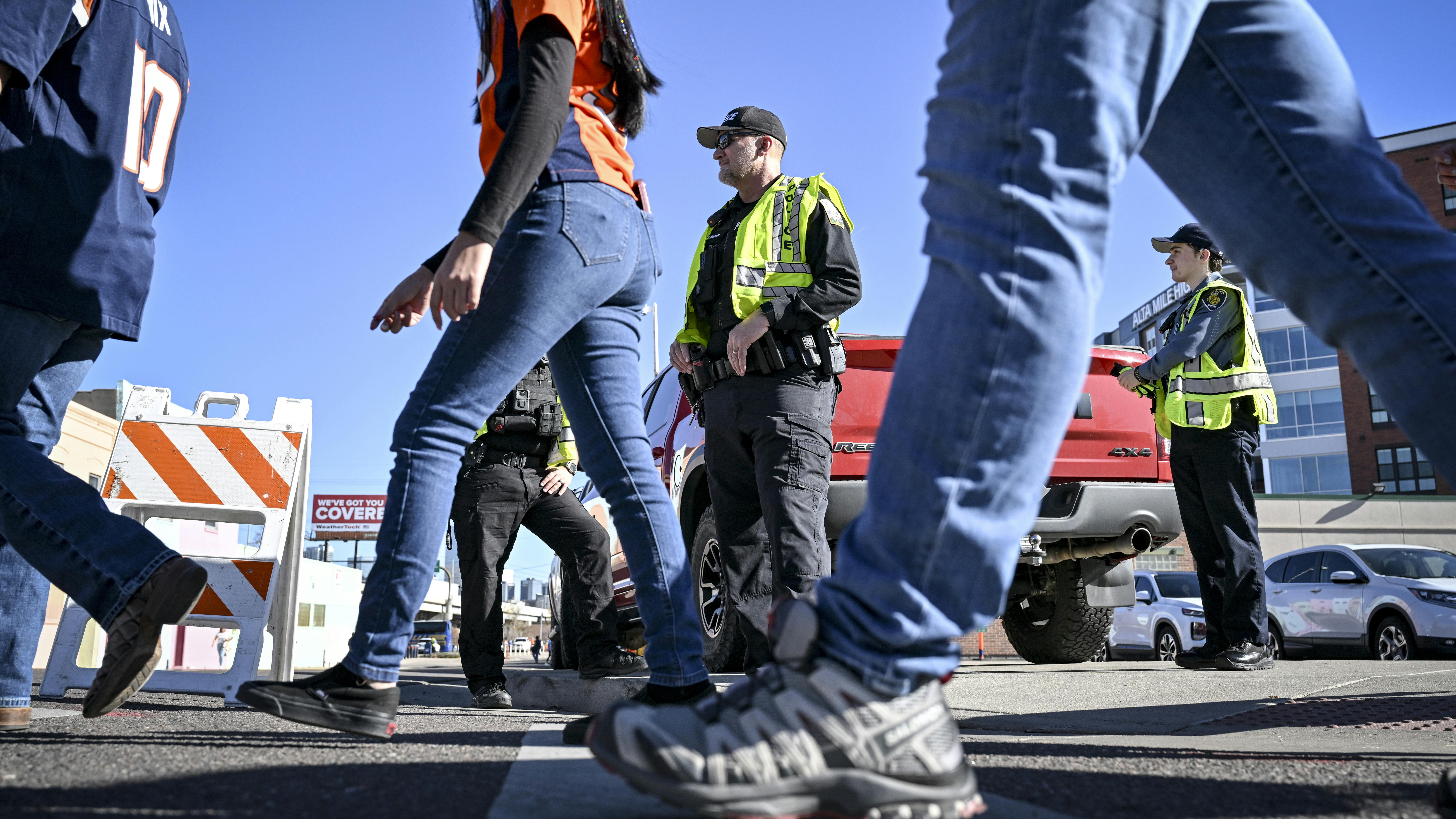 Colorado Ranger Mark Hanson providing traffic control before a Denver Broncos game.