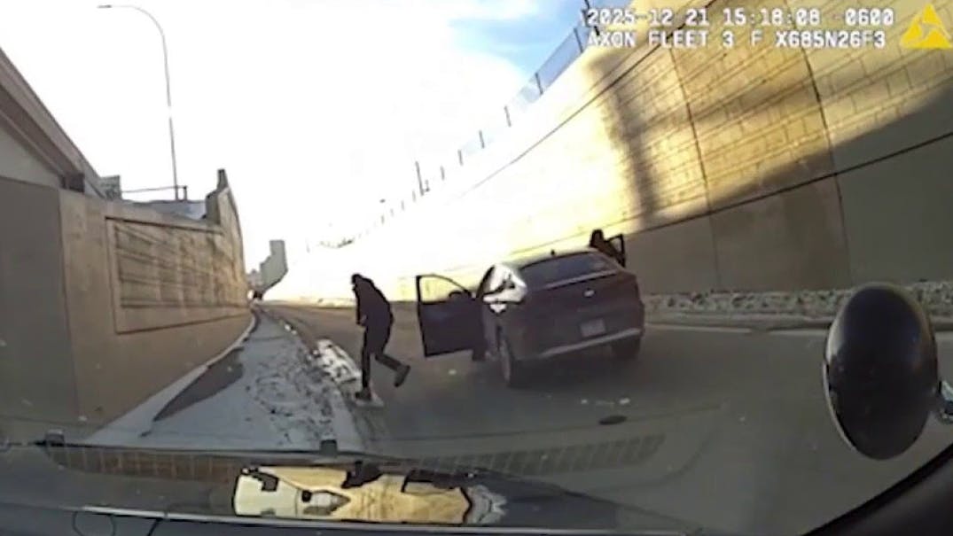 An accused car thief flees a stolen vehicle and points a gun at St. Paul, MN, police.