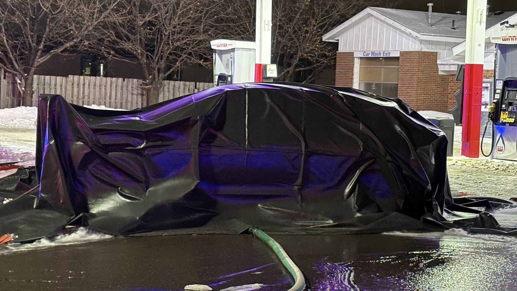 Brooklyn Center, MN, firefighters used a special tarplike blanket to extinguish an electric vehicle fire at a gas station.