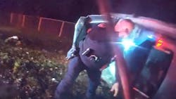 A Cortland, OH, police officer smashed a sunroof to reach a driver trapped inside a burning car. A Cortland, OH, police officer smashed a sunroof to reach a driver trapped inside a burning car.