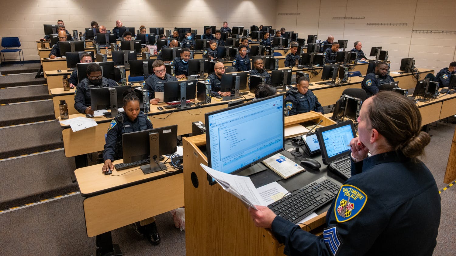 Baltimore Police officers take a digital test in a computer lab at the department's Education & Training Academy at the University of Baltimore on Dec. 22.