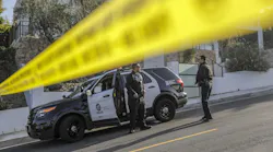 LAPD officers arrive at a crime scene in the Hollywood Hills.