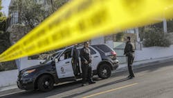 LAPD officers arrive at a crime scene in the Hollywood Hills. LAPD officers arrive at a crime scene in the Hollywood Hills.