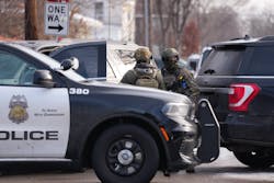 Law enforcement officials stand on the scene of a potential shooting at E 34th St. and Portland Ave. in Minneapolis on Jan. 7. Law enforcement officials stand on the scene of a potential shooting at E 34th St. and Portland Ave. in Minneapolis on Jan. 7.