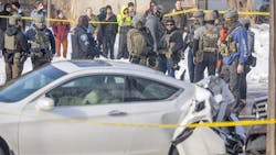 Law enforcement agents stand at the scene of a shooting near E 34th Street and Portland Avenue in Minneapolis on Jan. 7. Law enforcement agents stand at the scene of a shooting near E 34th Street and Portland Avenue in Minneapolis on Jan. 7.