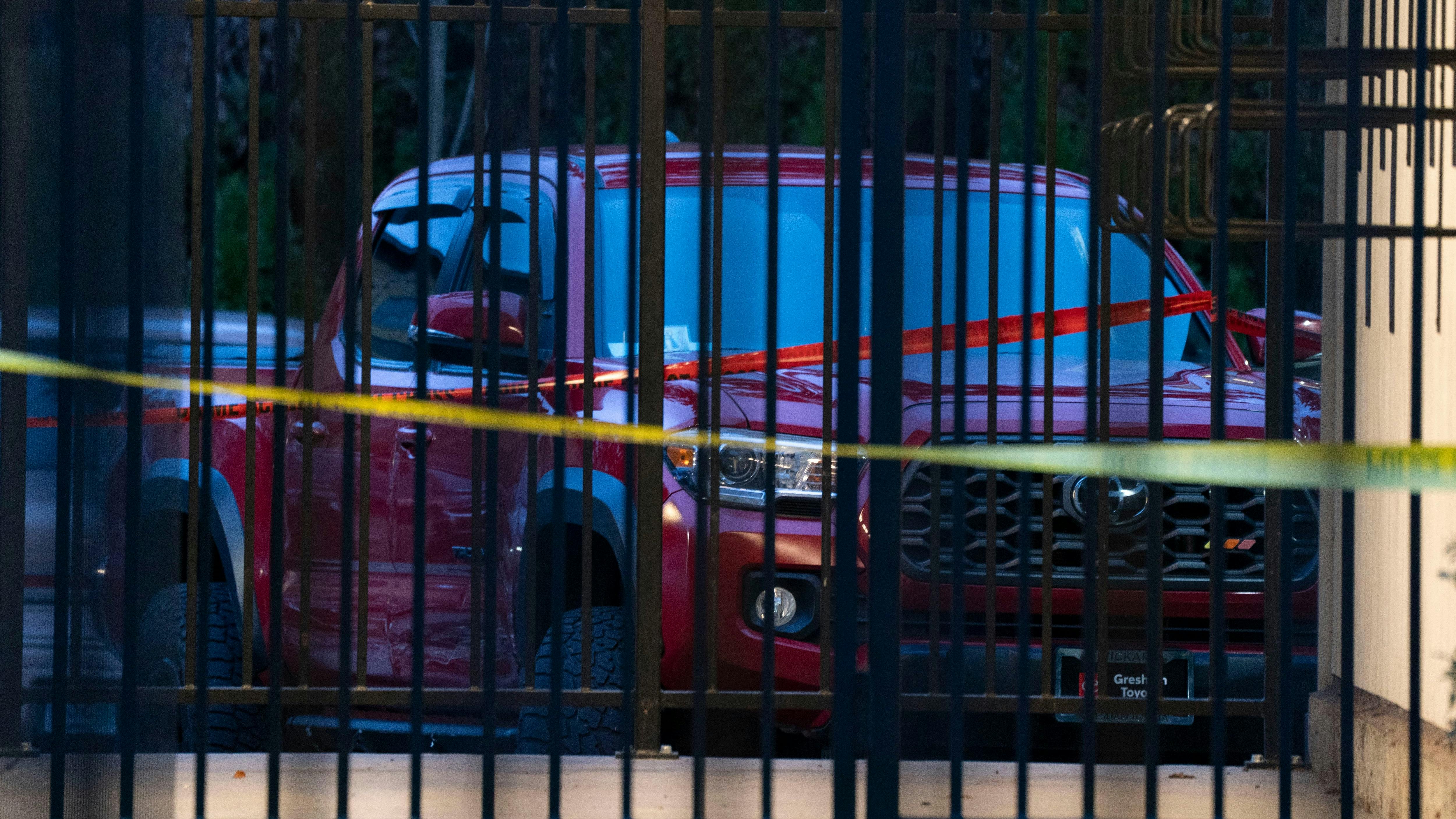 The scene at Southeast 146th and East Burnside Street, where a red truck, shown here, ended up after allegedly being involved in a shooting with Border Patrol in Portland, Oregon, Thursday, January, 8, 2026.