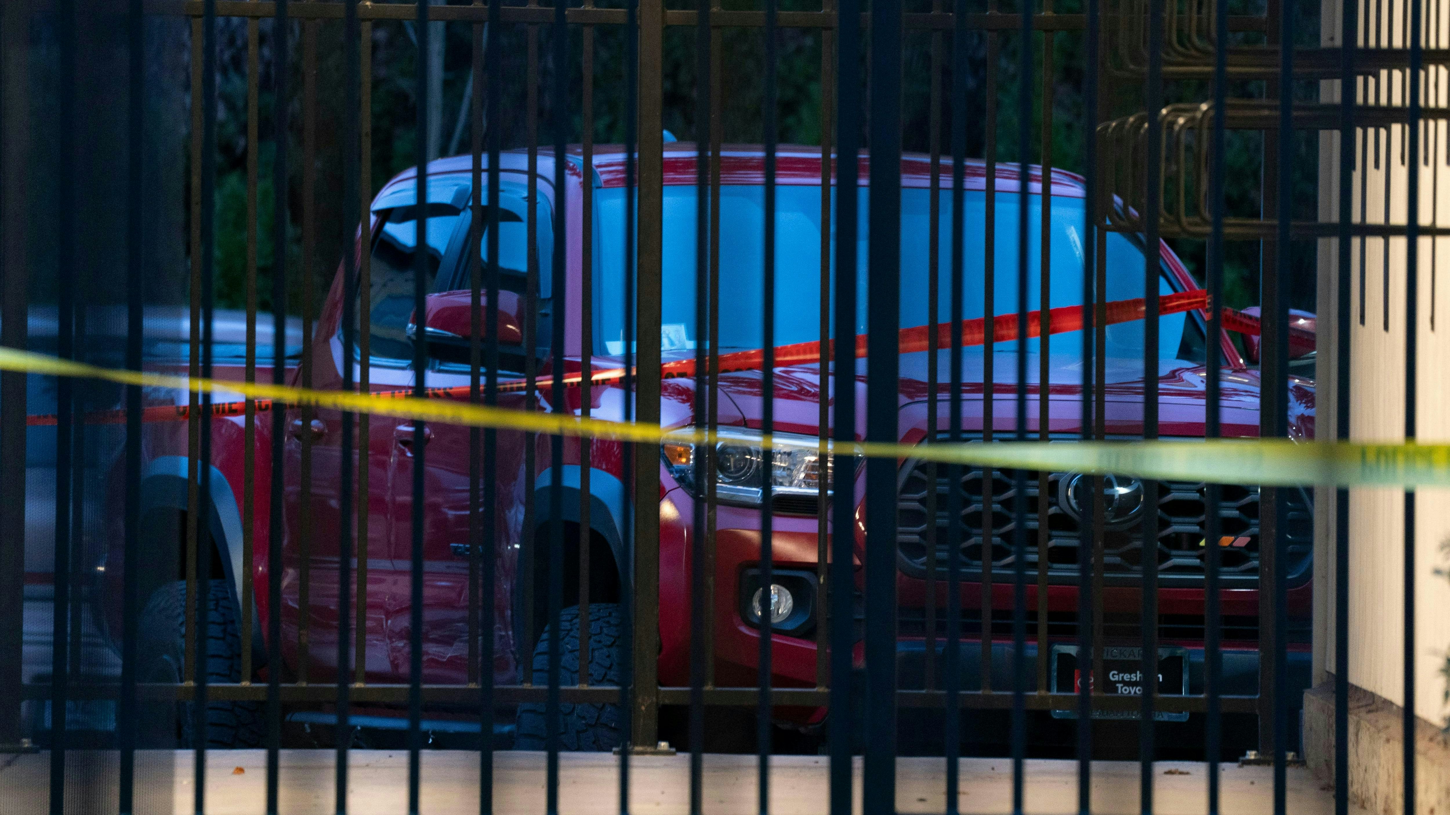 The scene at Southeast 146th and East Burnside Street, where a red truck, shown here, ended up after allegedly being involved in a shooting with Border Patrol in Portland, Oregon, Thursday, January, 8, 2026.