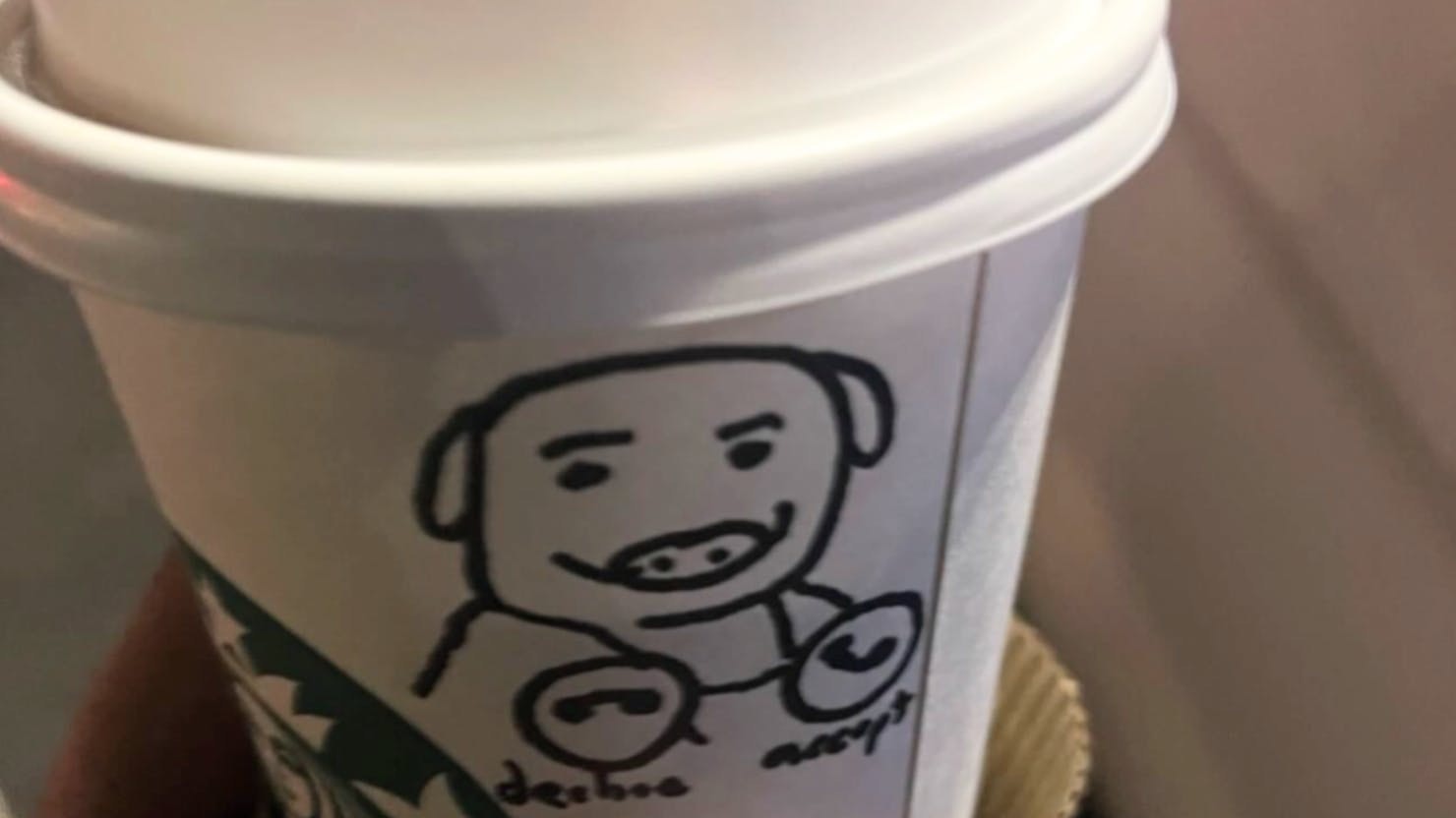 Officials say a deputy was deliberately served a cup bearing a hand-drawn image of a pig.