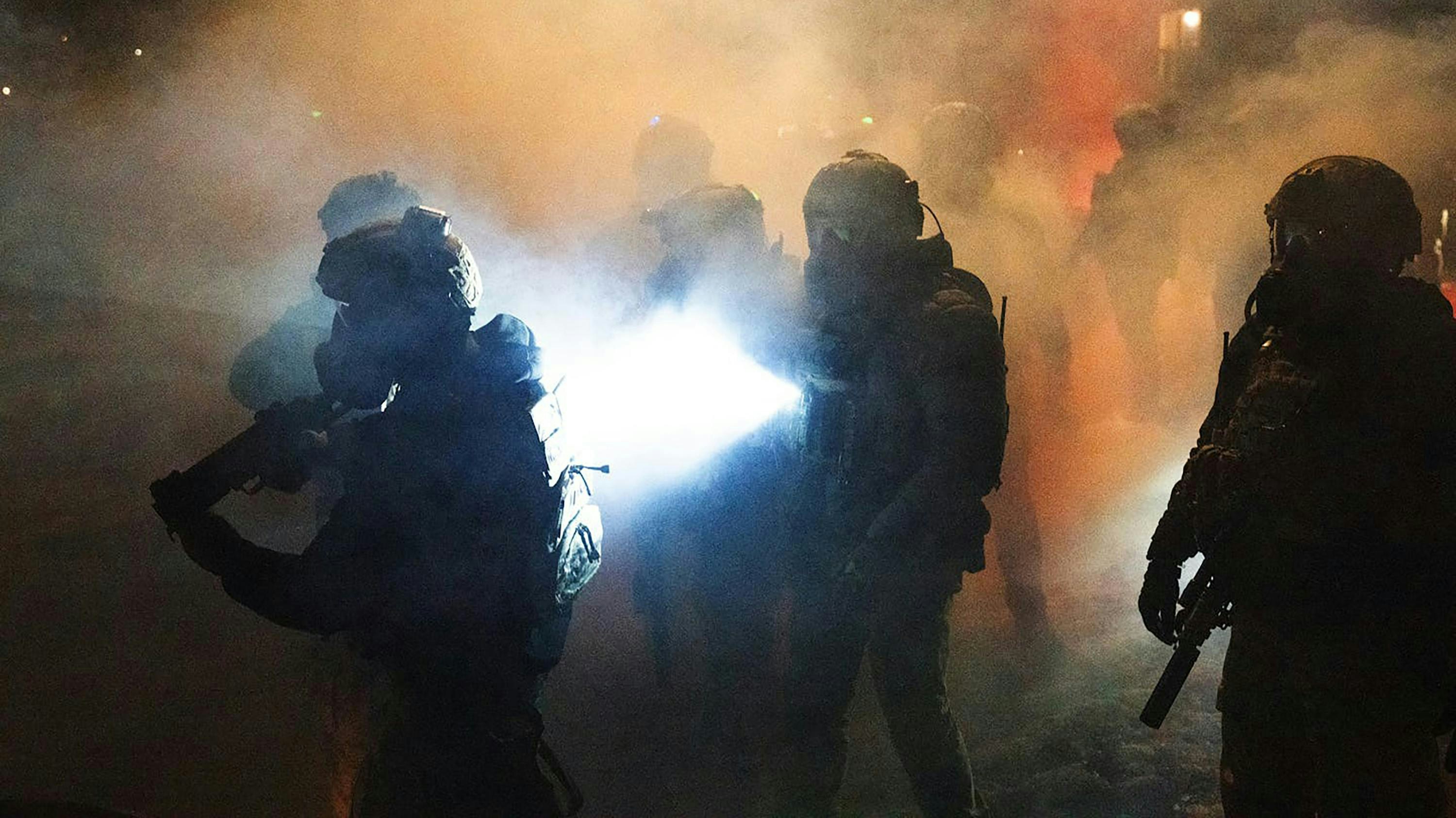 Federal agents deploy chemical irritants as they try to push demonstrators farther from the scene where a federal agent shot a man in north Minneapolis on Wednesday, Jan. 14, 2026.
