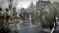 Protesters, some filming with their phones, yell at federal agents on Jan. 13, 2026, near where Renee Good was killed in Minneapolis. Protesters, some filming with their phones, yell at federal agents on Jan. 13, 2026, near where Renee Good was killed in Minneapolis.