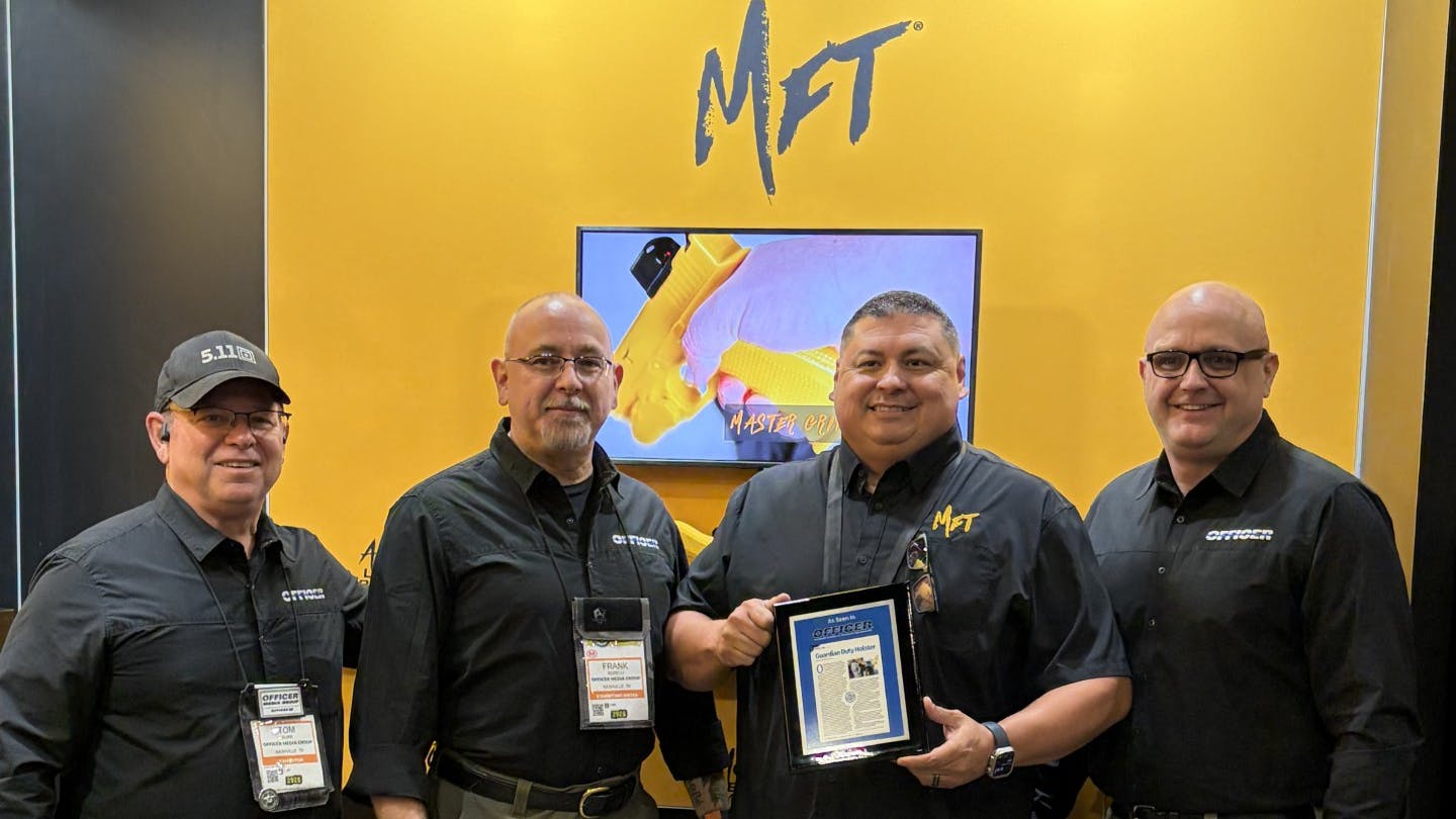 Executive VP Bobby McGee accepts the OFFICER Labs award for Mission First Tactical&rsquo;s Guardian holster, presented by VP of Public Safety Bill MacRae, Director of Sales Tim Burr and Editorial Director retired Lt. Frank Borelli from OFFICER Media Group.