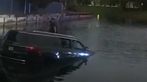 Video footage shows Broward County Sheriff's Deputy Juliana Tenaglia rescue a motorist trapped in a submerged vehicle on Jan. 12.