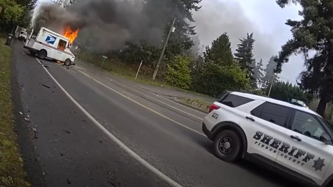 A Pierce County Sheriff&rsquo;s Office deputy rescued an injured mail truck driver from a burning vehicle following a two-vehicle collision in Parkland, Washington, according to the agency.
