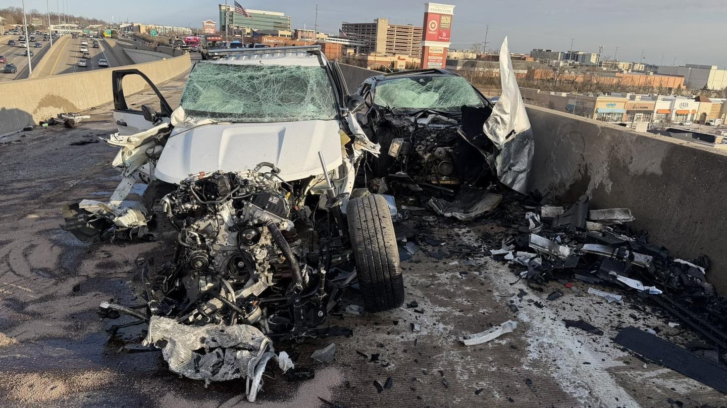 Two St. Louis Police officers were helping county police at around 2:30 p.m. when the suspects' vehicle collided with the marked city patrol car on the flyover ramp interchange