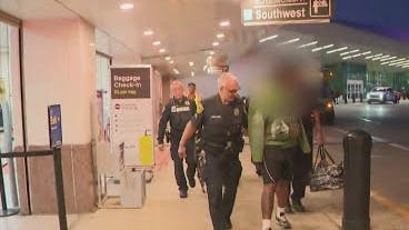 Houston police with suspect who tried to breach plane cockpit.
