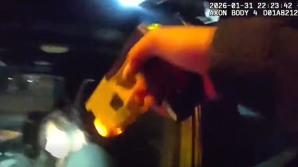 Colorado Springs, CO, police confront a woman who rushed an officer in a cruiser.